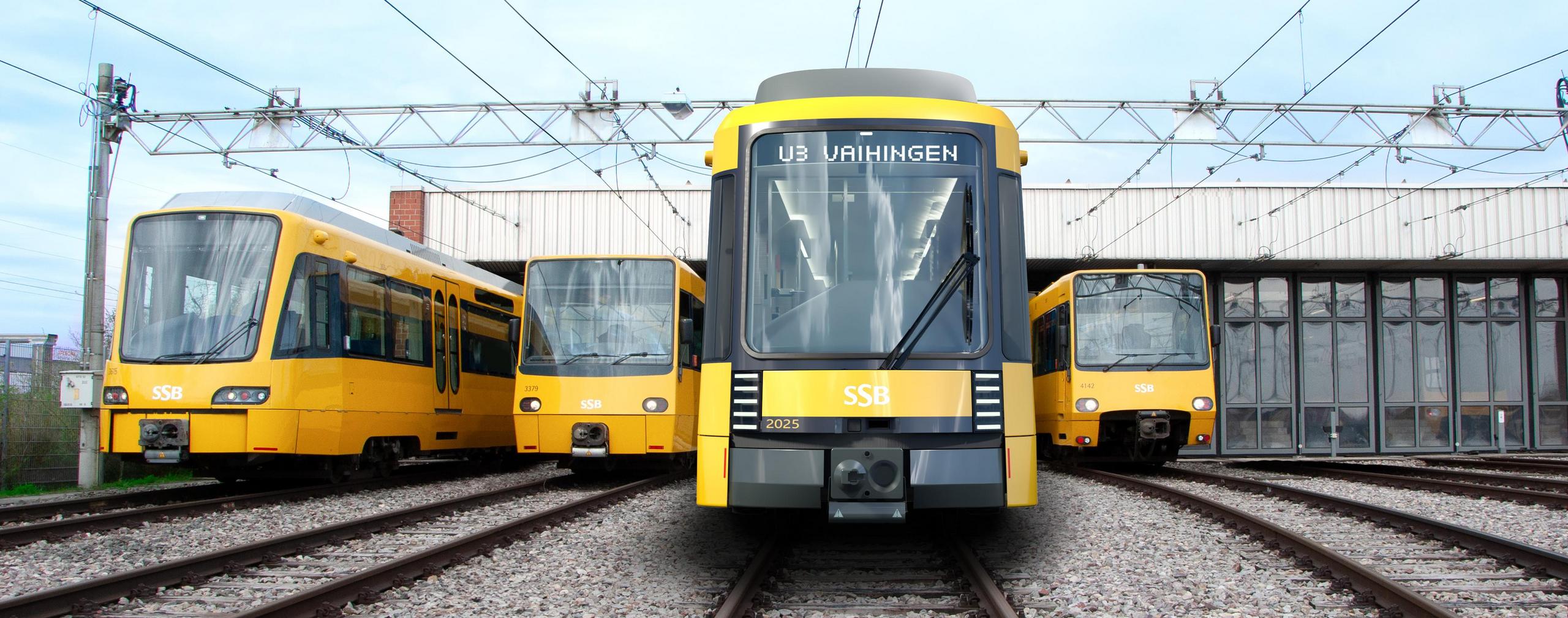 Vier Stadtbahnen mit unterschiedlichen Fronten stehen vor einem Betriebshof.